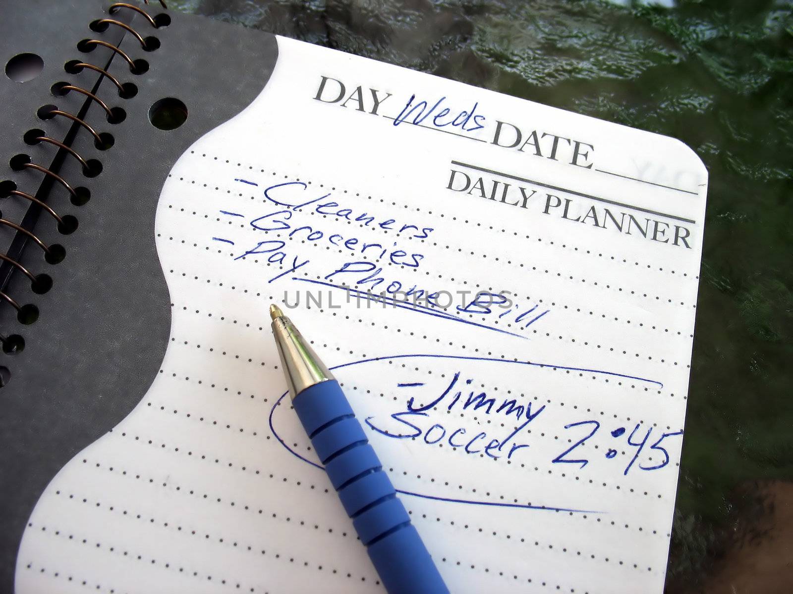 A daily planner filled with a busy parent's daily activities.