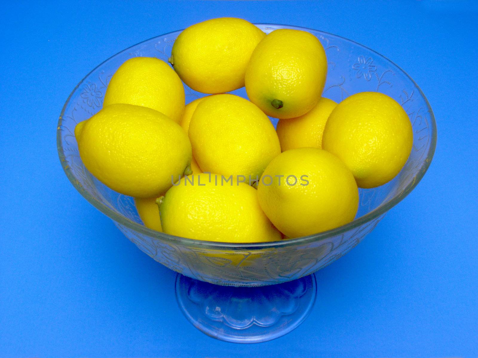 Bowl of lemons by paulglover