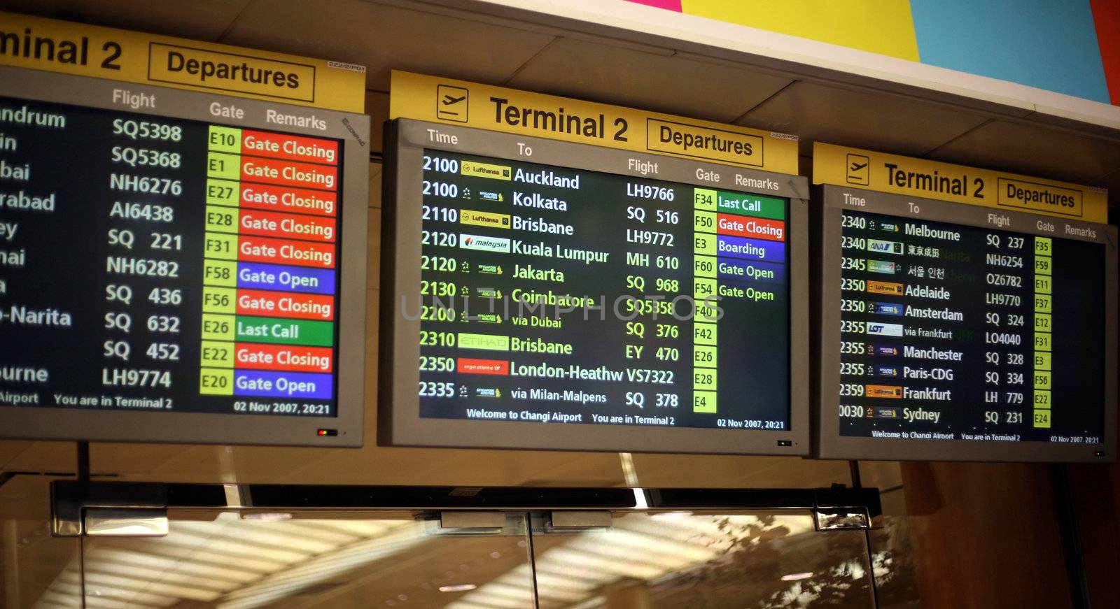 a flight announcement shows time of departure on a screen