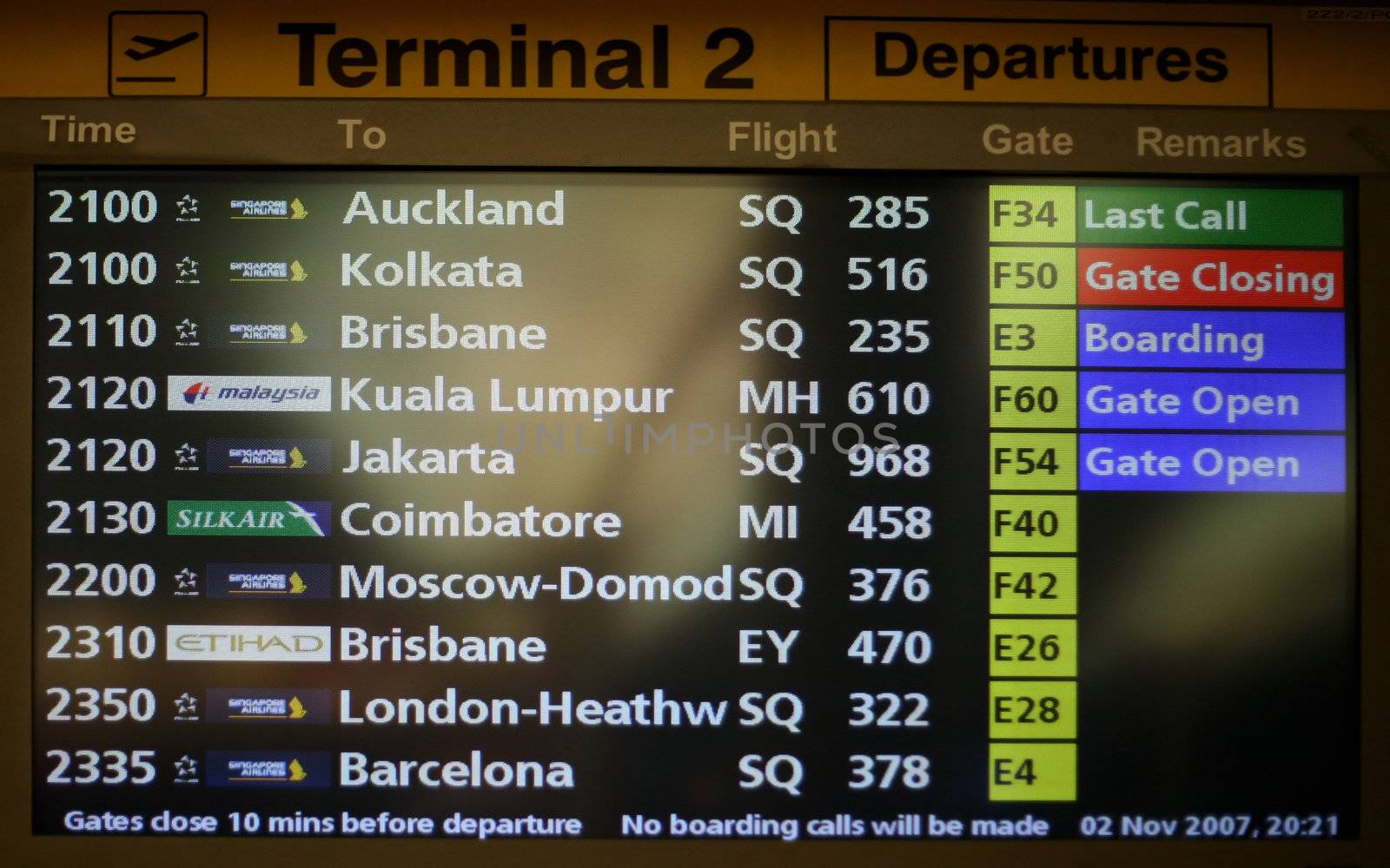 Flight announcement shows time of departure on a screen