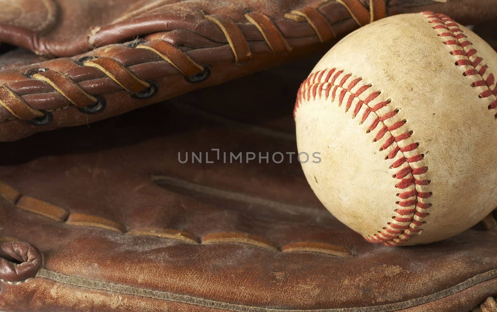 a macro of a baseball in glove