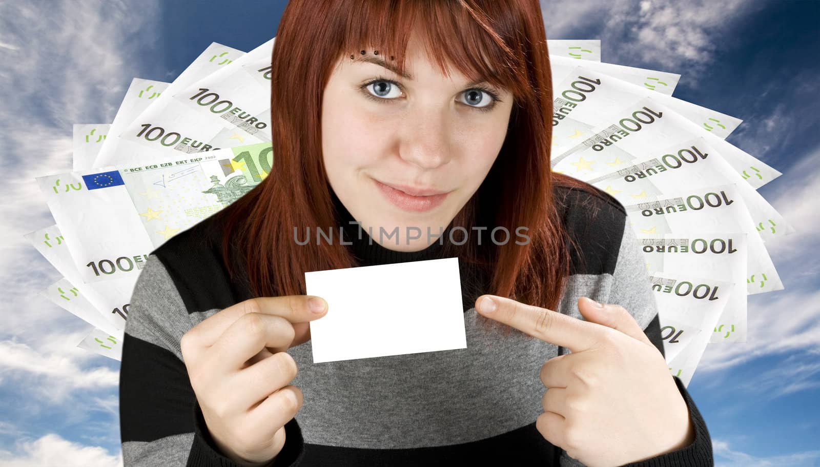 Girl pointing at a blank business card with a money background by domencolja