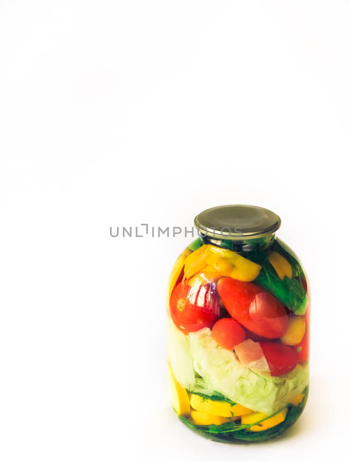 pickled cucumber and tomato in glass