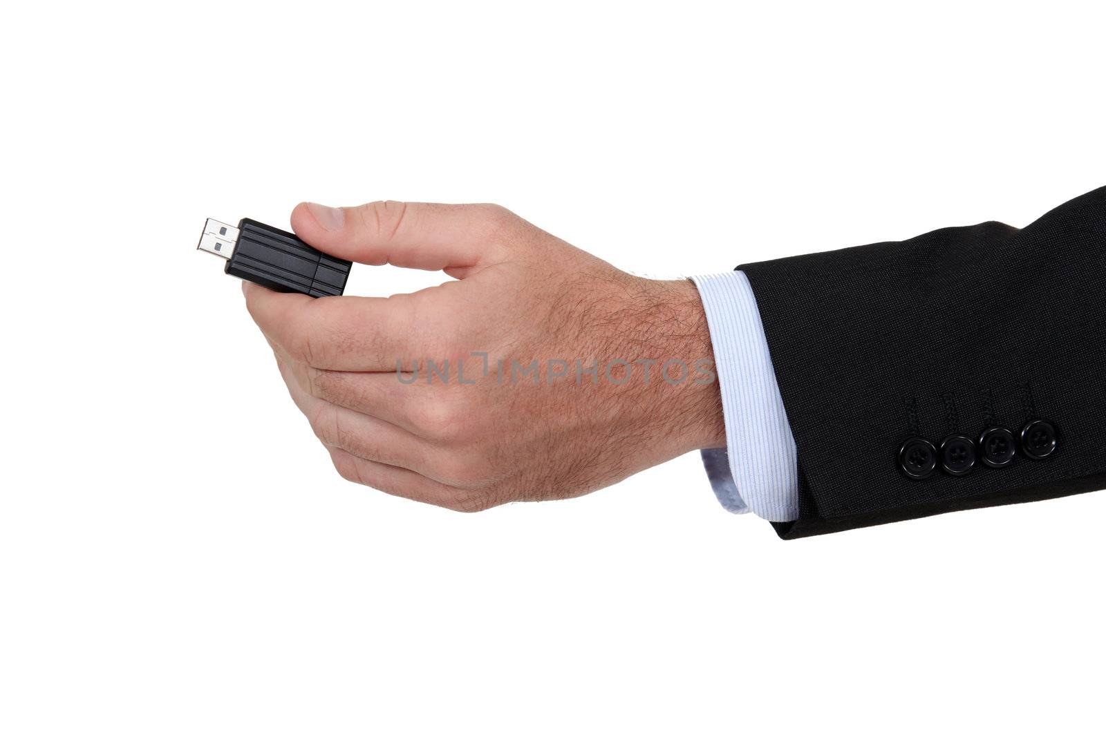 Man holding a USB key. by phovoir