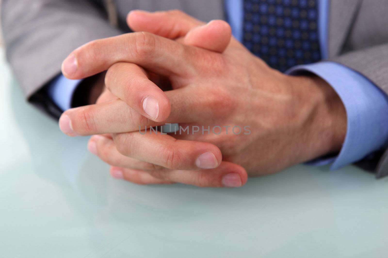 Human hands clasped