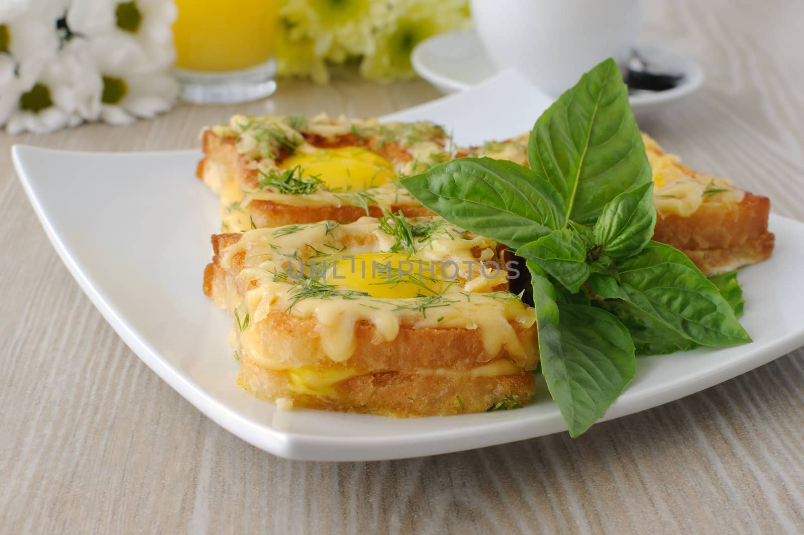 Toast with egg and cheese with dill and a cup of coffee