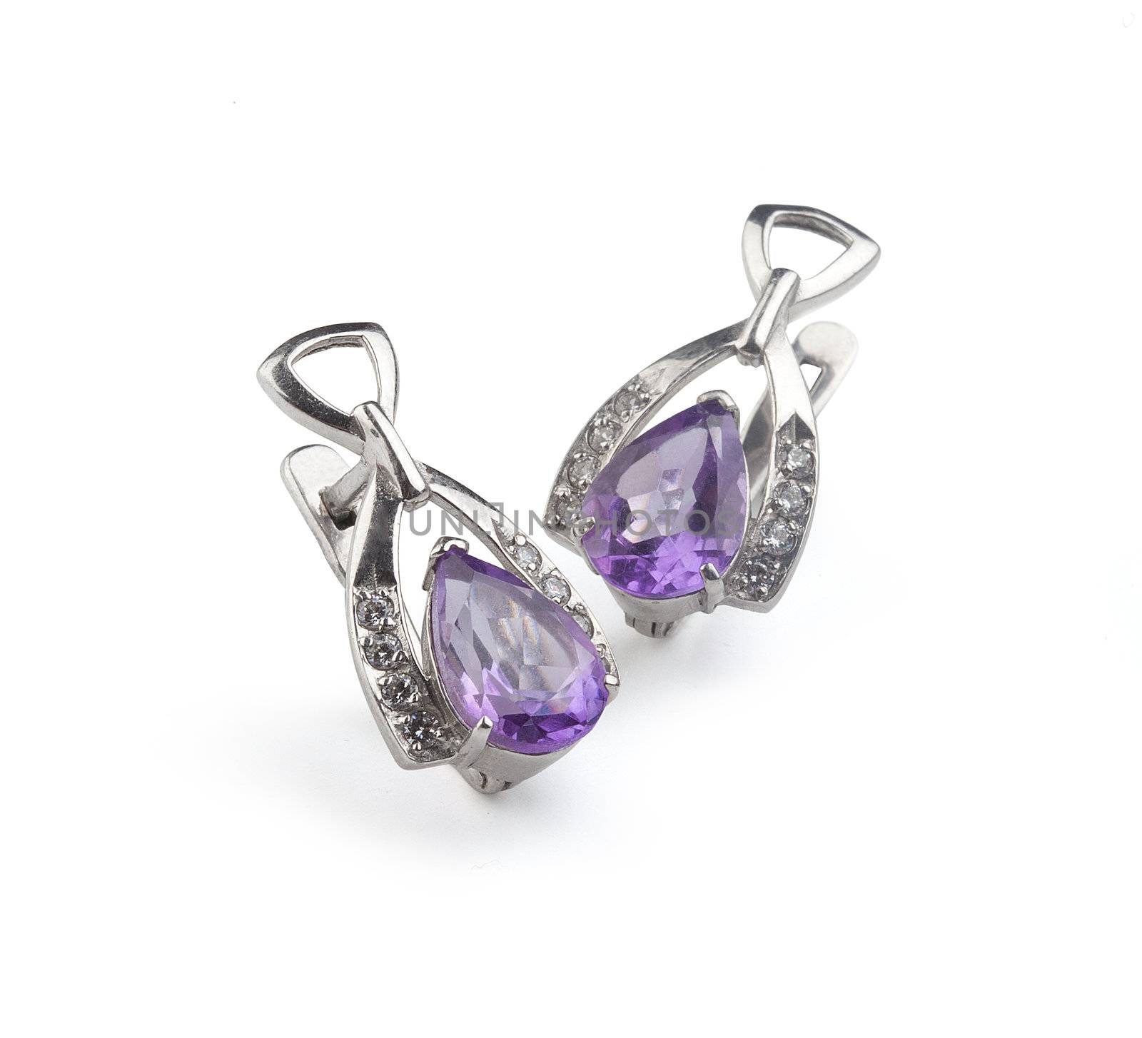 Silver ear-ring with amethyst on the white background
