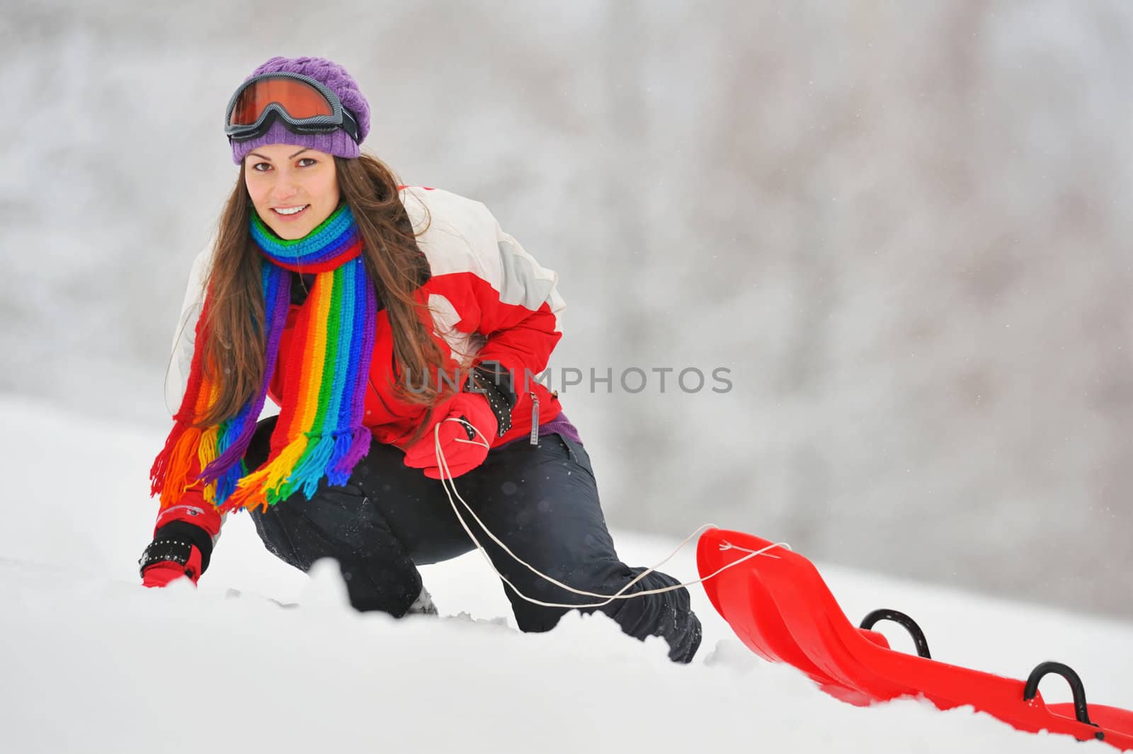 Young Beautiful Woman play in winter time