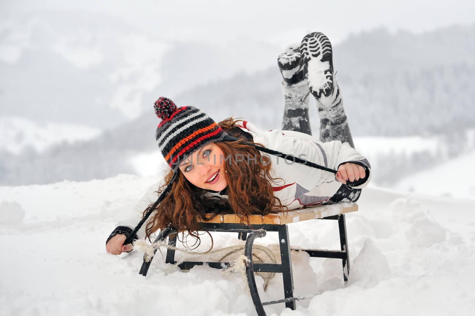 Young Beautiful Woman on sledge by jordachelr
