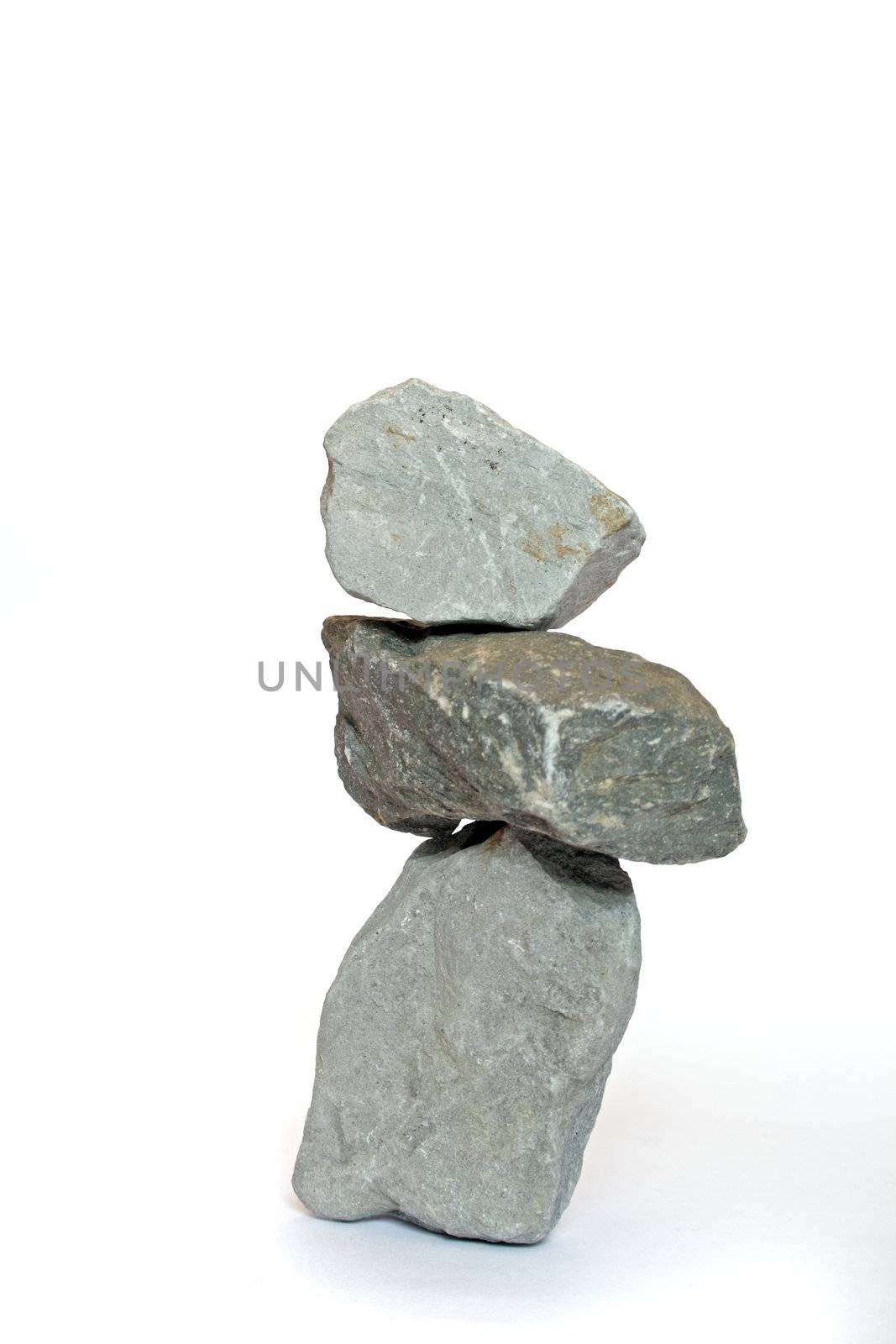 Three rocks one upon the other. All isolated on white background.