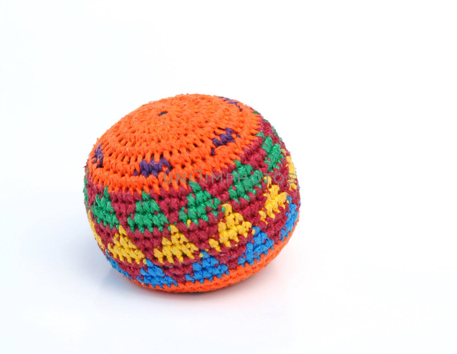 A typical hackysack isolated on a plain white background.