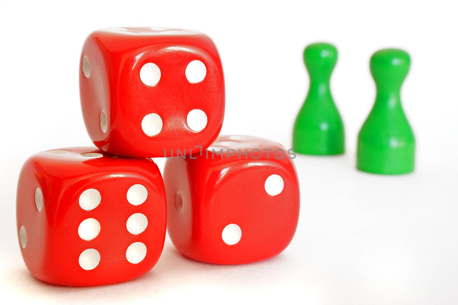 Red dices and green figures. All isolated on white background.