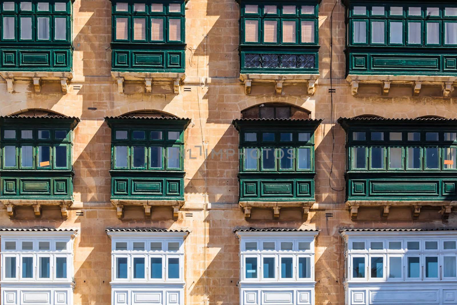 Typical house facade with balconies in Valletta, Malta