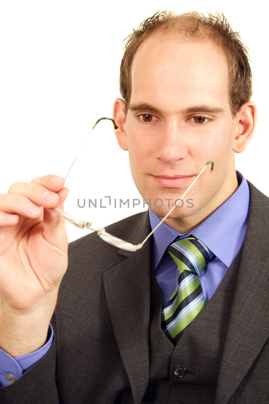 A businessman taking off his glasses. All isolated on white background.
** Note: Slight graininess, best at smaller sizes.