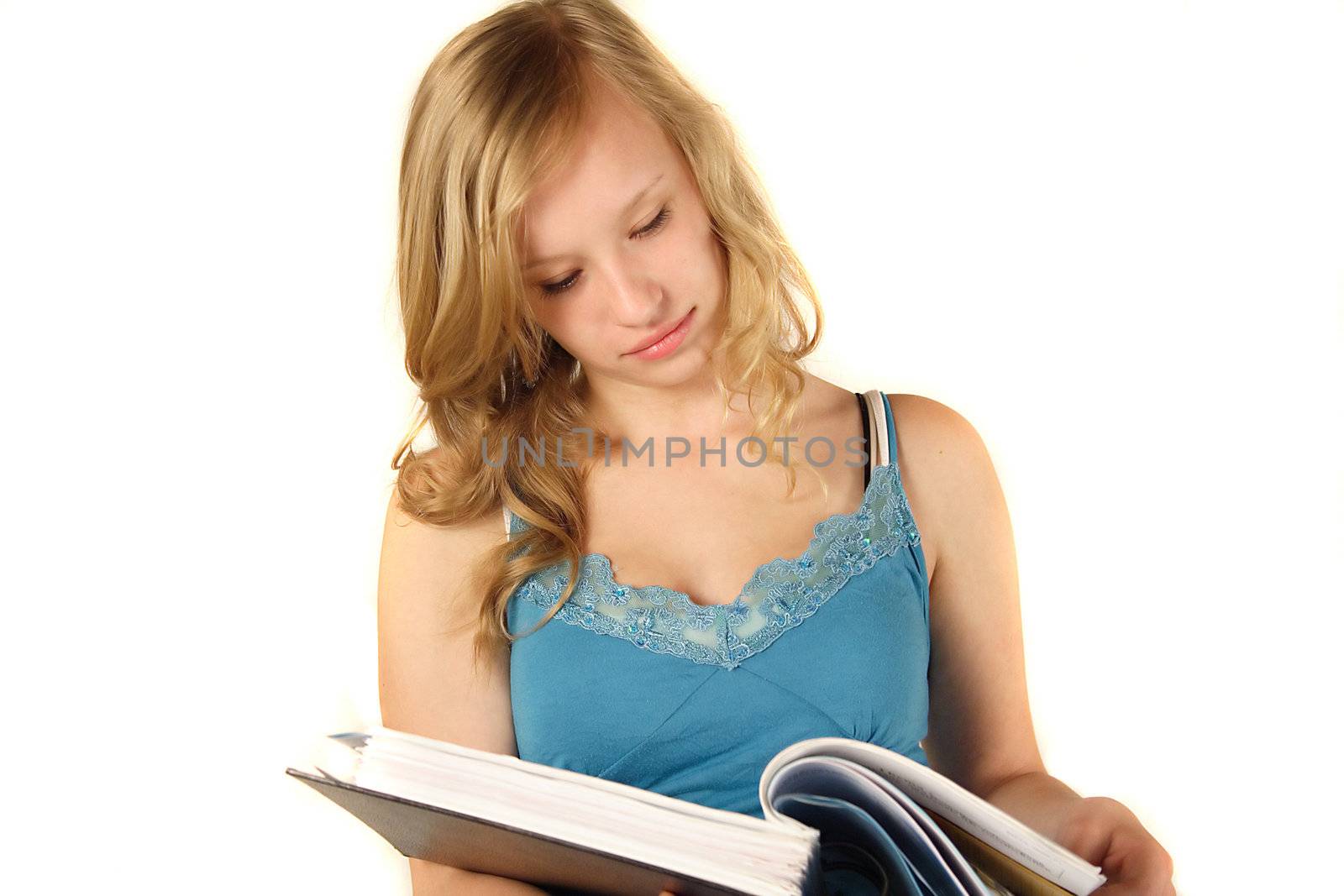 A young ambitious student reading. All isolated on white background.