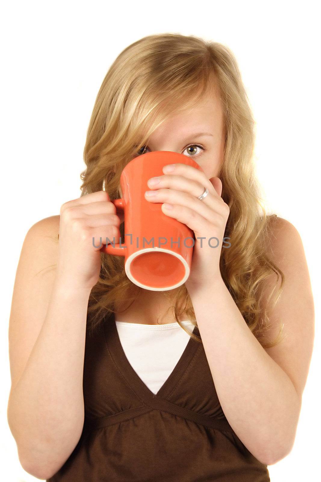 A young handsome woman drinking a cup of coffee. All isolated on white background.