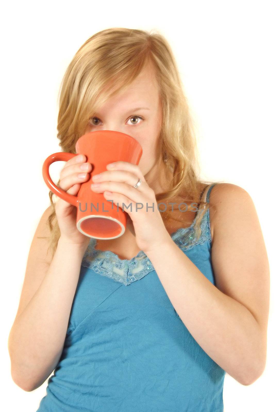 A young handsome woman drinking a cup of coffee. All isolated on white background.