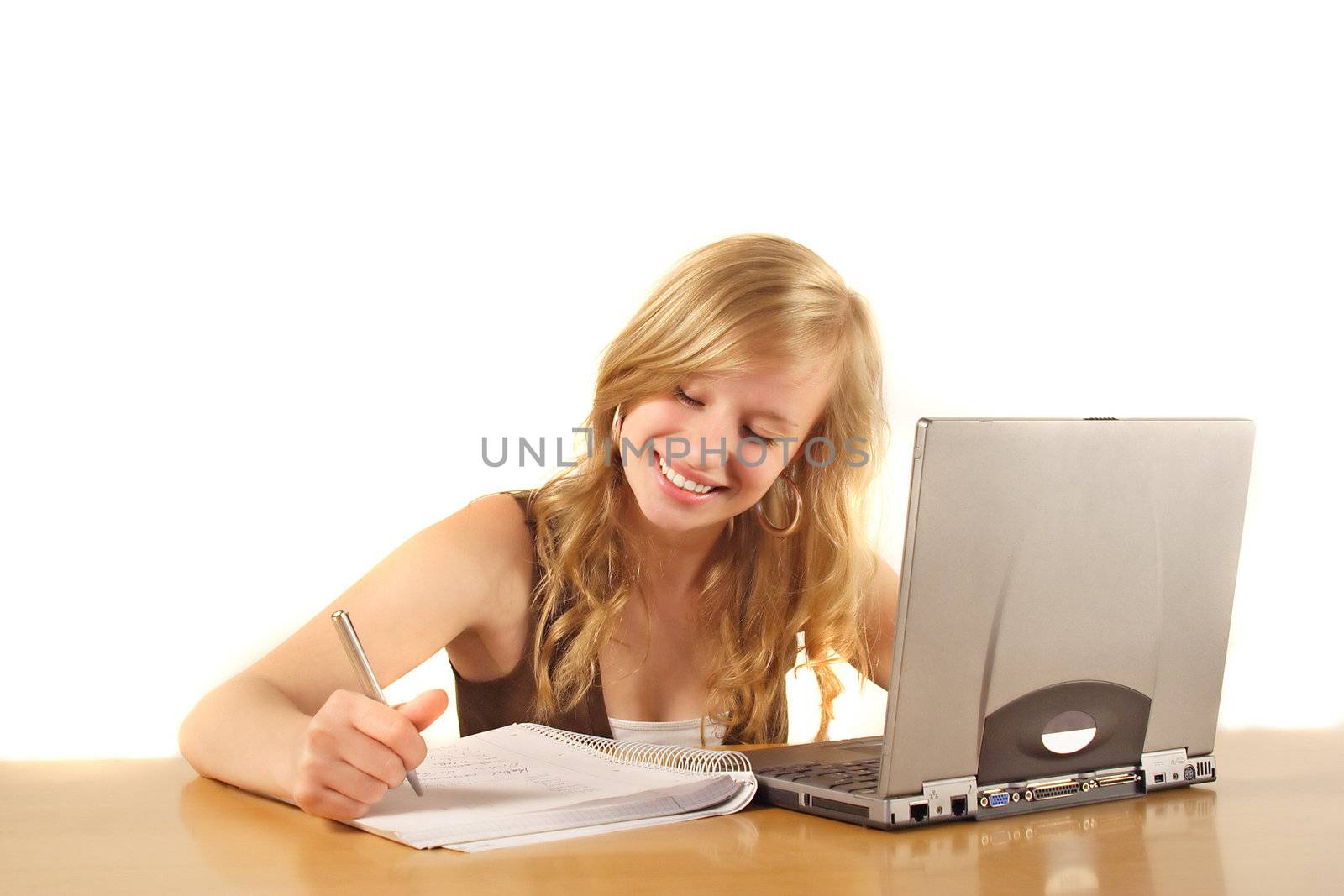 A young smarting woman at her workplace. All isolated on white background.