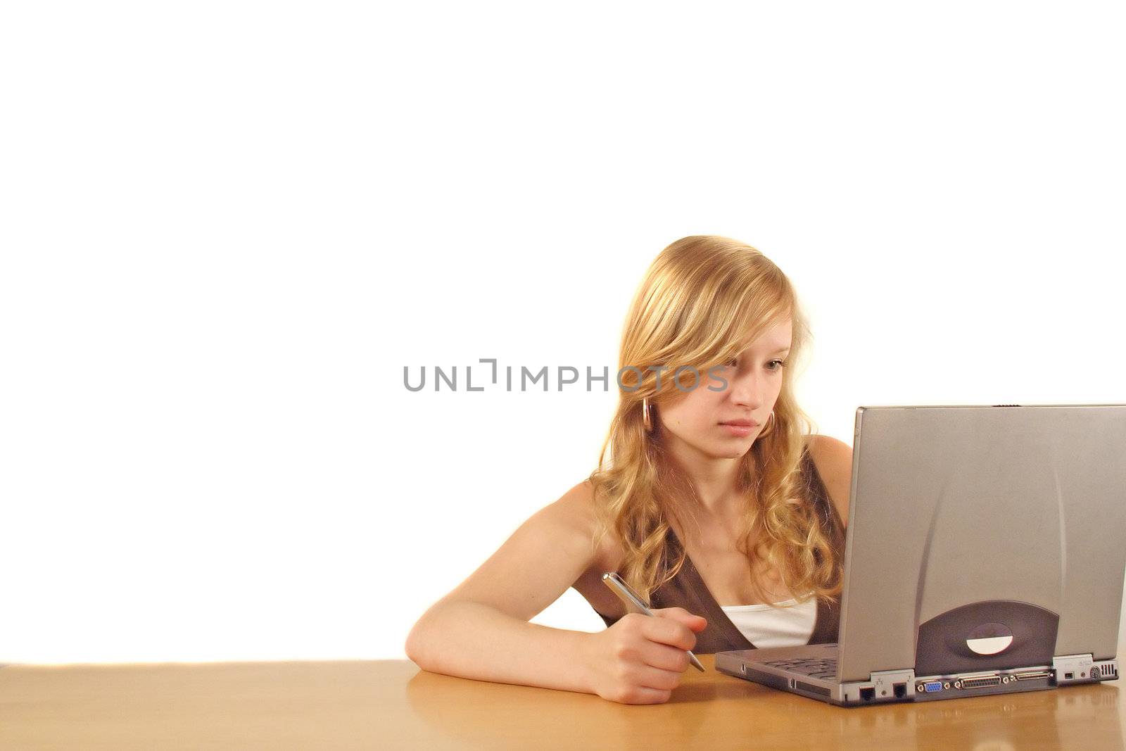 A young smarting woman at her workplace. All isolated on white background.