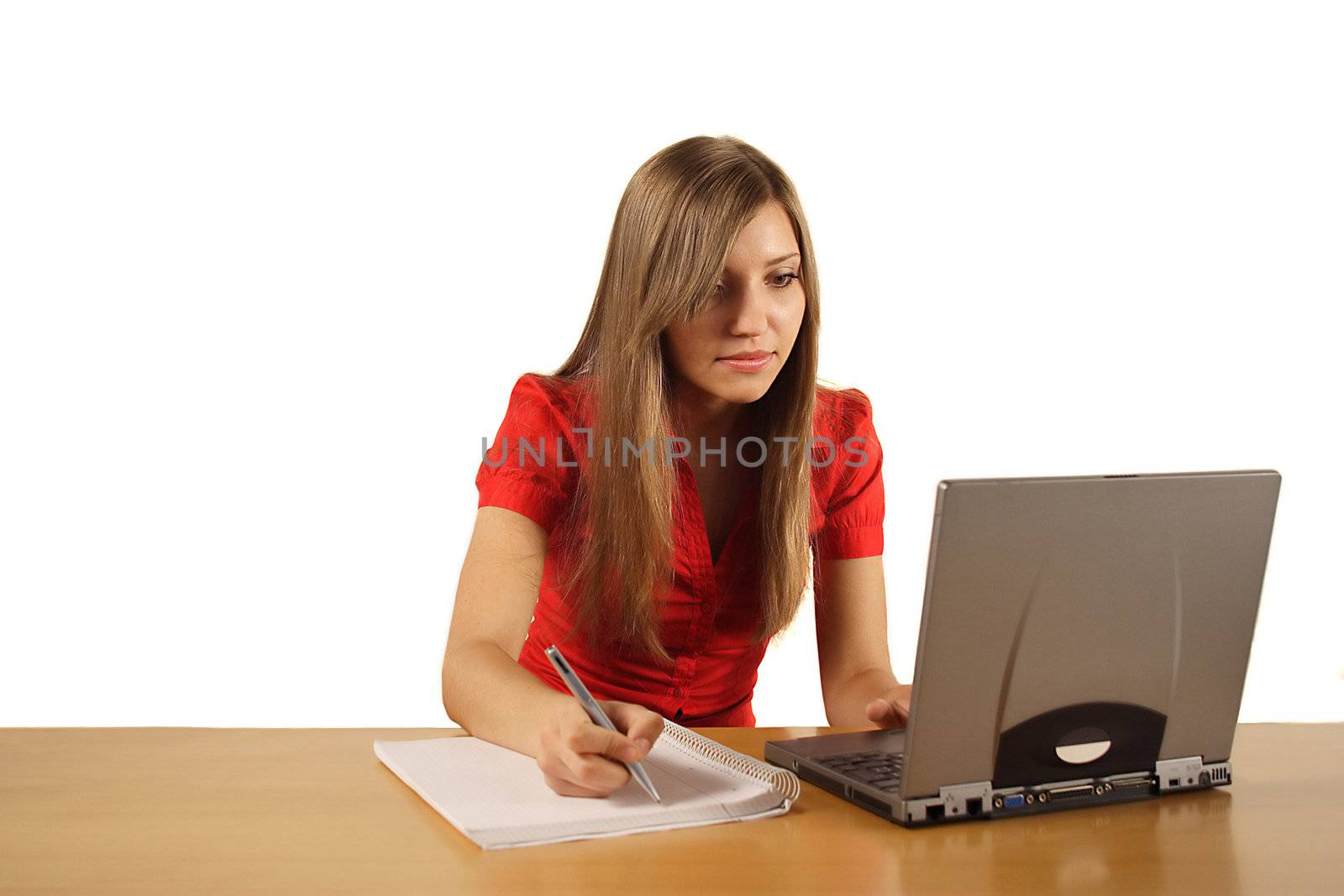 A young handsome woman working concentrated. All isolated on white background.
