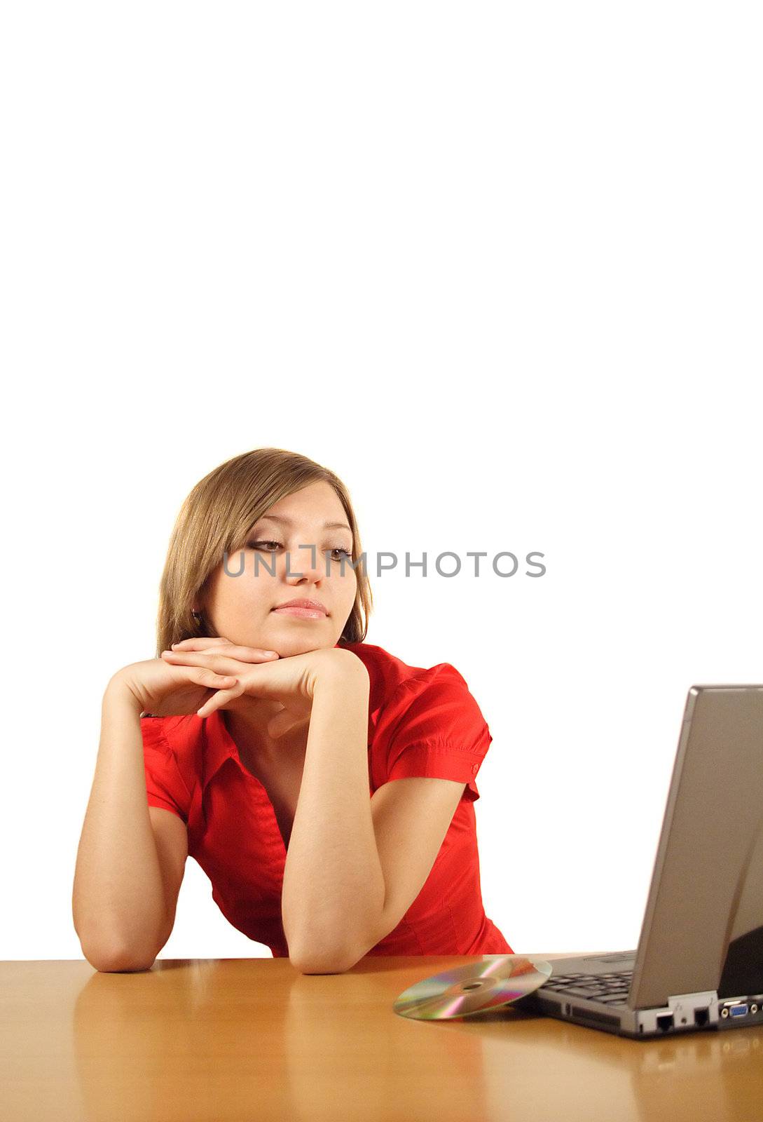 A young handsome student waiting for the installation process of her notebook computer. All isolated on white background.