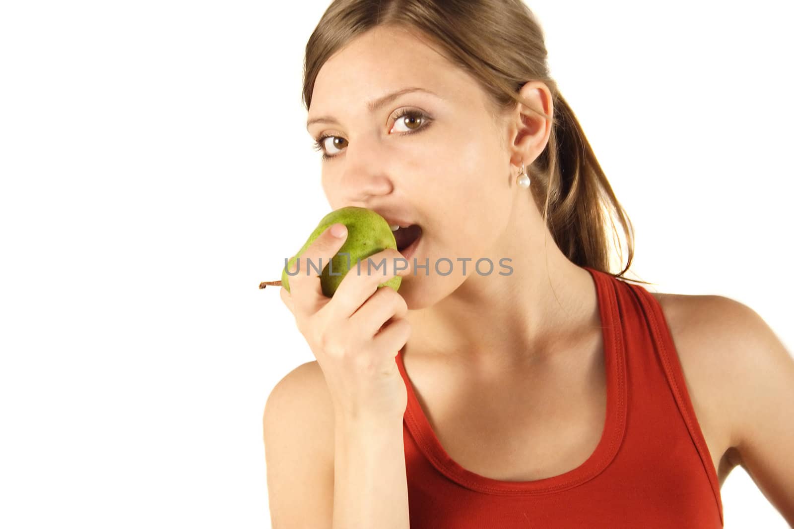A young handsome woman eating an apple. All isolated on white background.