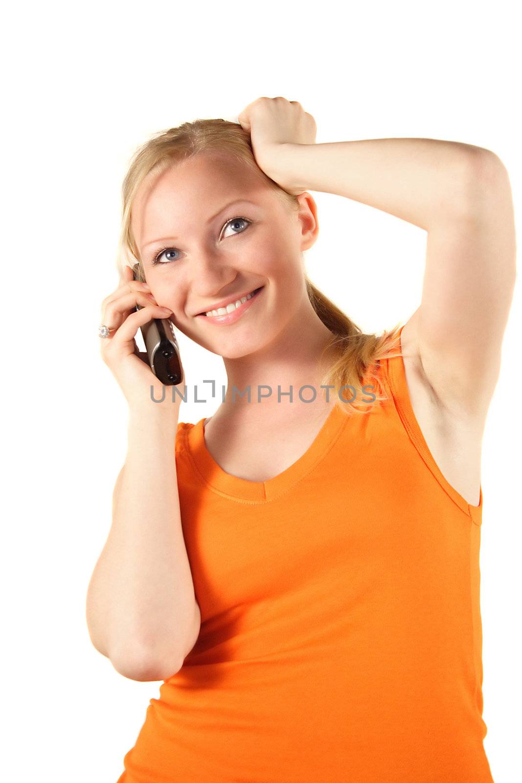 A young handsome woman gets a surprising call. All isolated on white background.