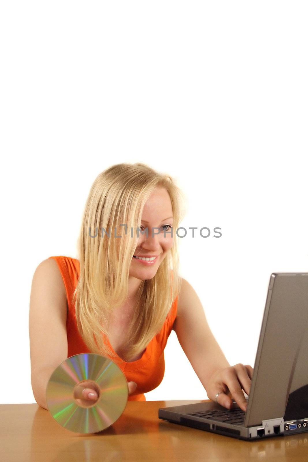 A young handsome woman installing software on her notebook computer. All islated on white background.