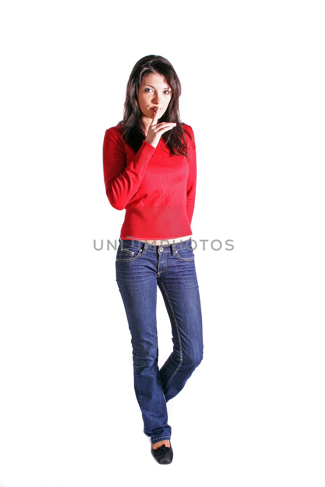 Full length shof of an attractive young woman asks for silence. All on white background.