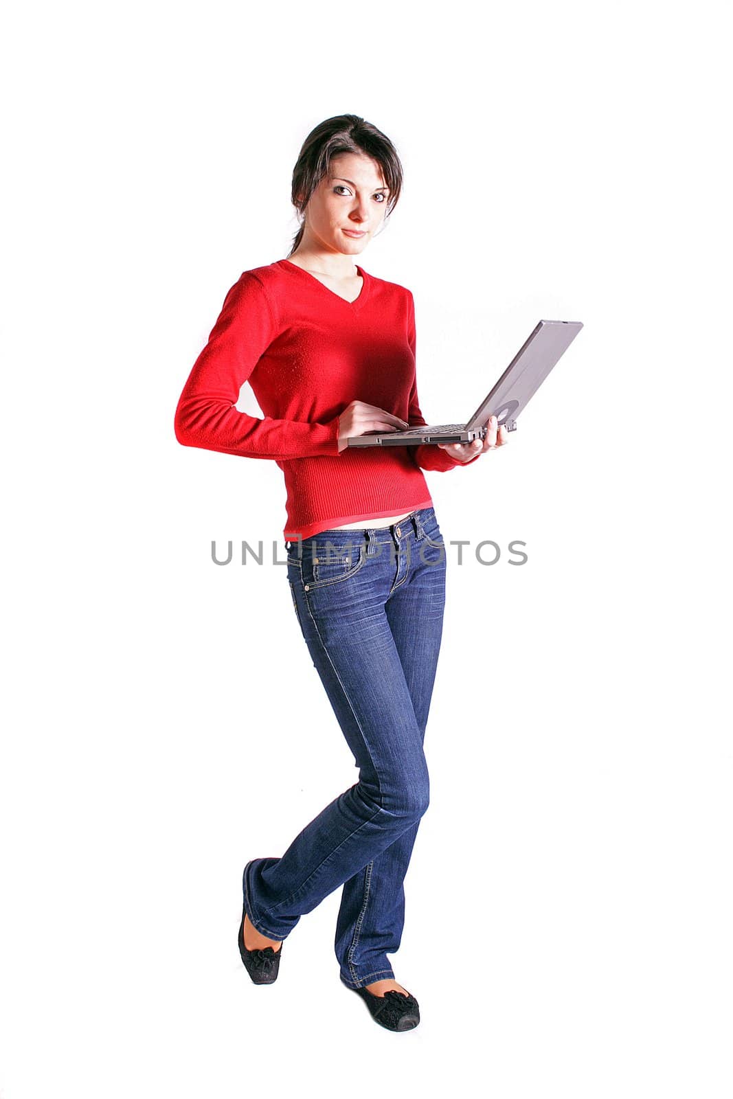 Attractive young woman using laptop. All on white background.