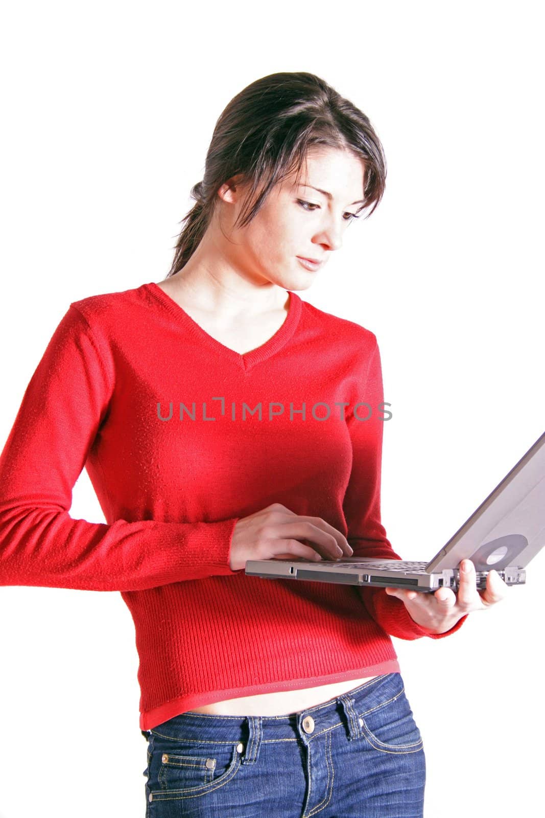 Attractive young woman using laptop. All on white background.