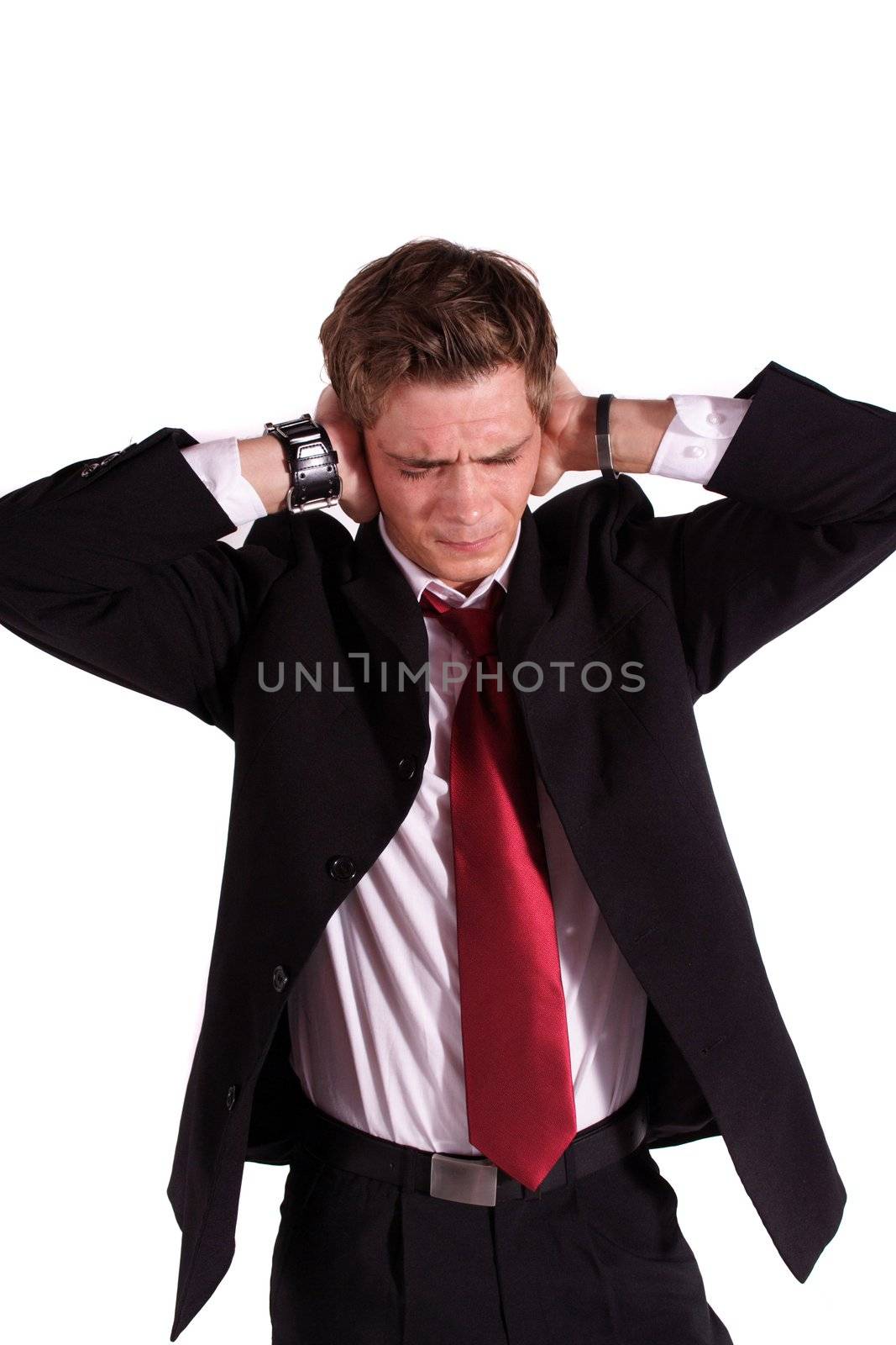 A smart businessman suffering from noise. All isolated on white background.