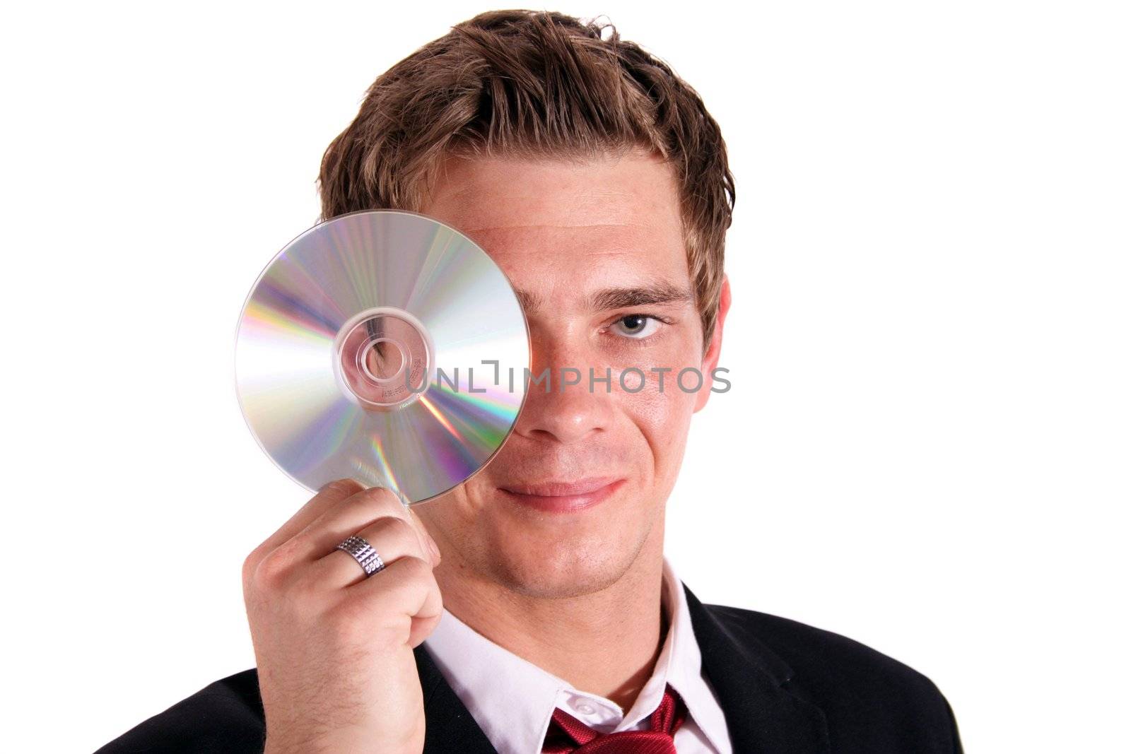 A smarting businessman holding a cd or dvd. All isolated on white background.