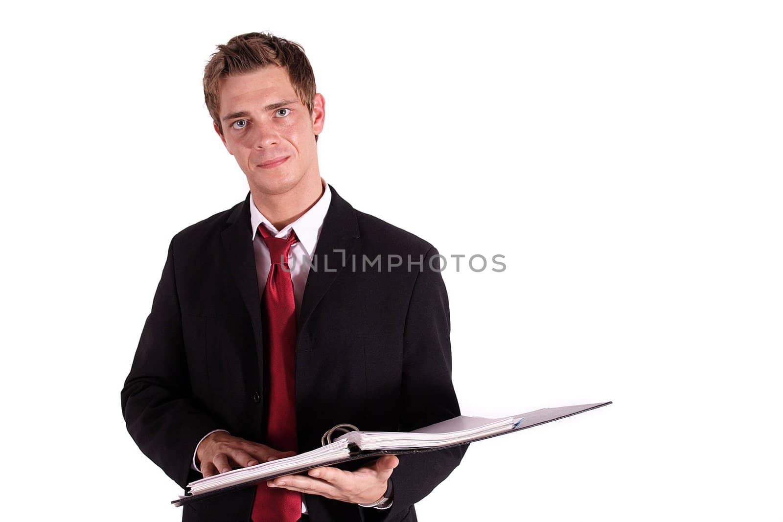 A smart businessman reviewing some files. All isolated on white background.