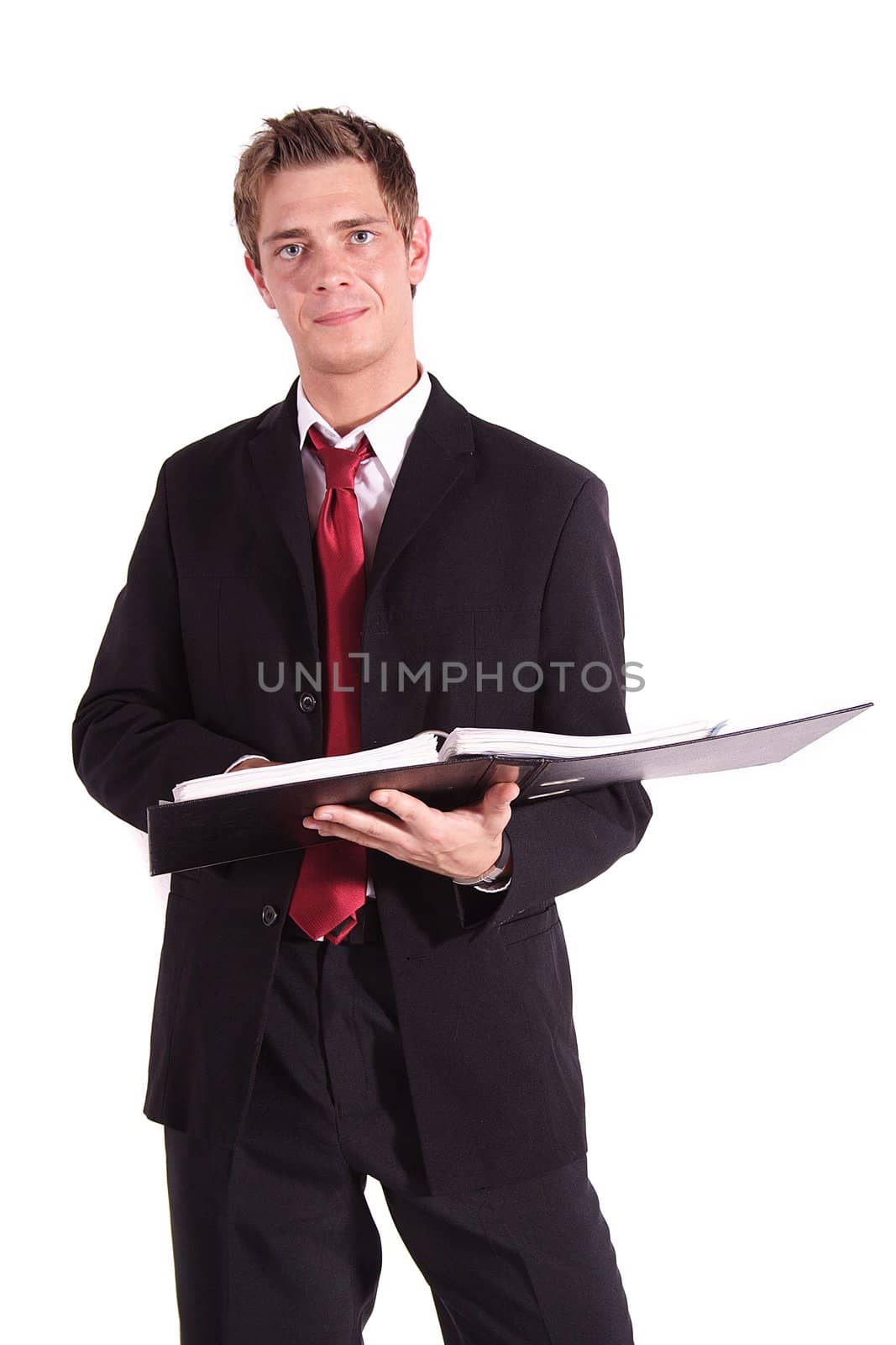 A smart businessman reviewing some files. All isolated on white background.