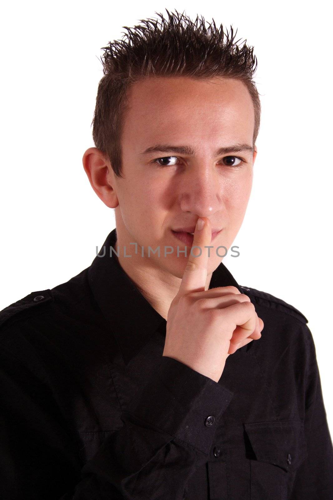 A young handsome man asks for silence. All isolated on white background.