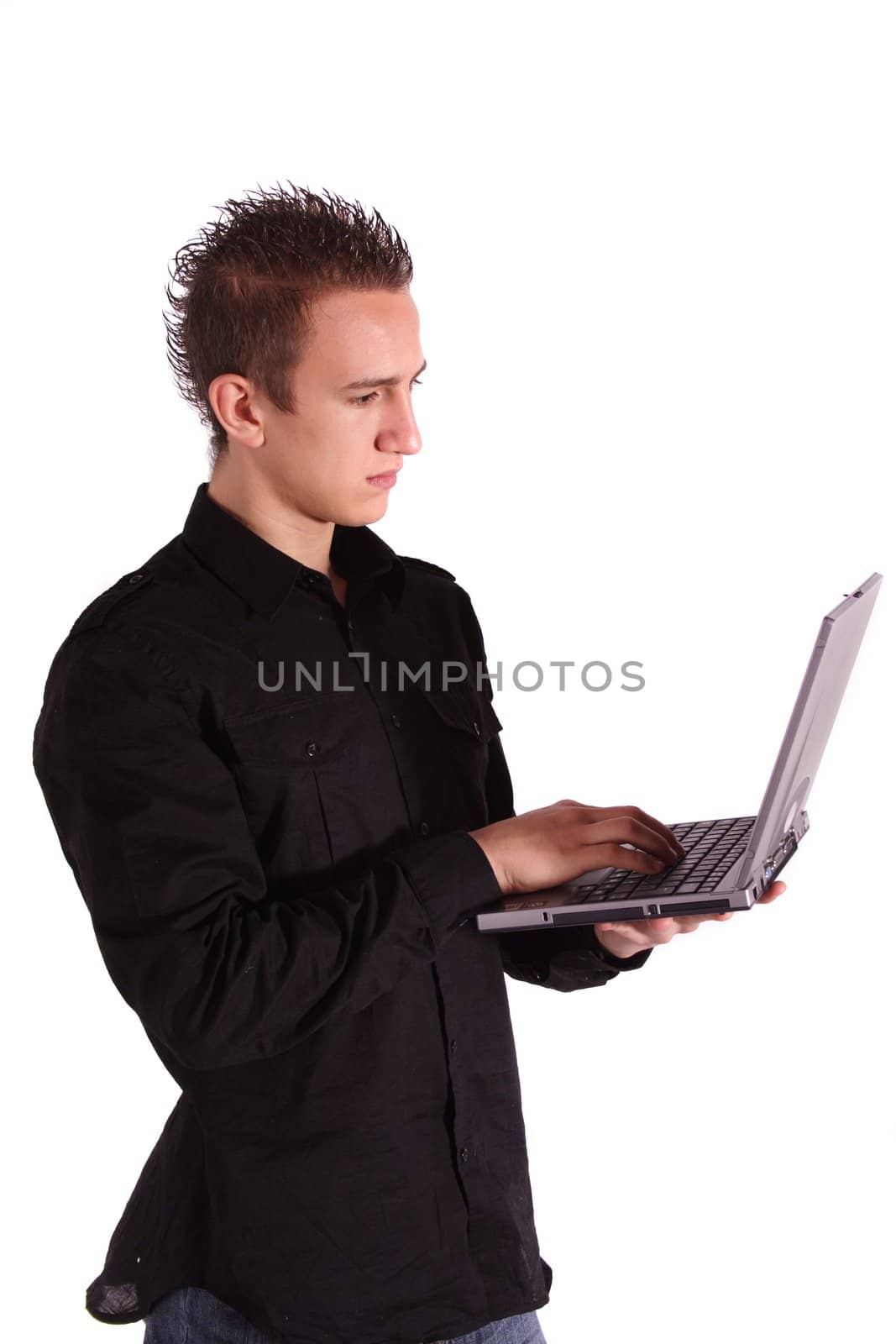 A young handsome man surfing the internet with his notebook computer. All isolated on white background.