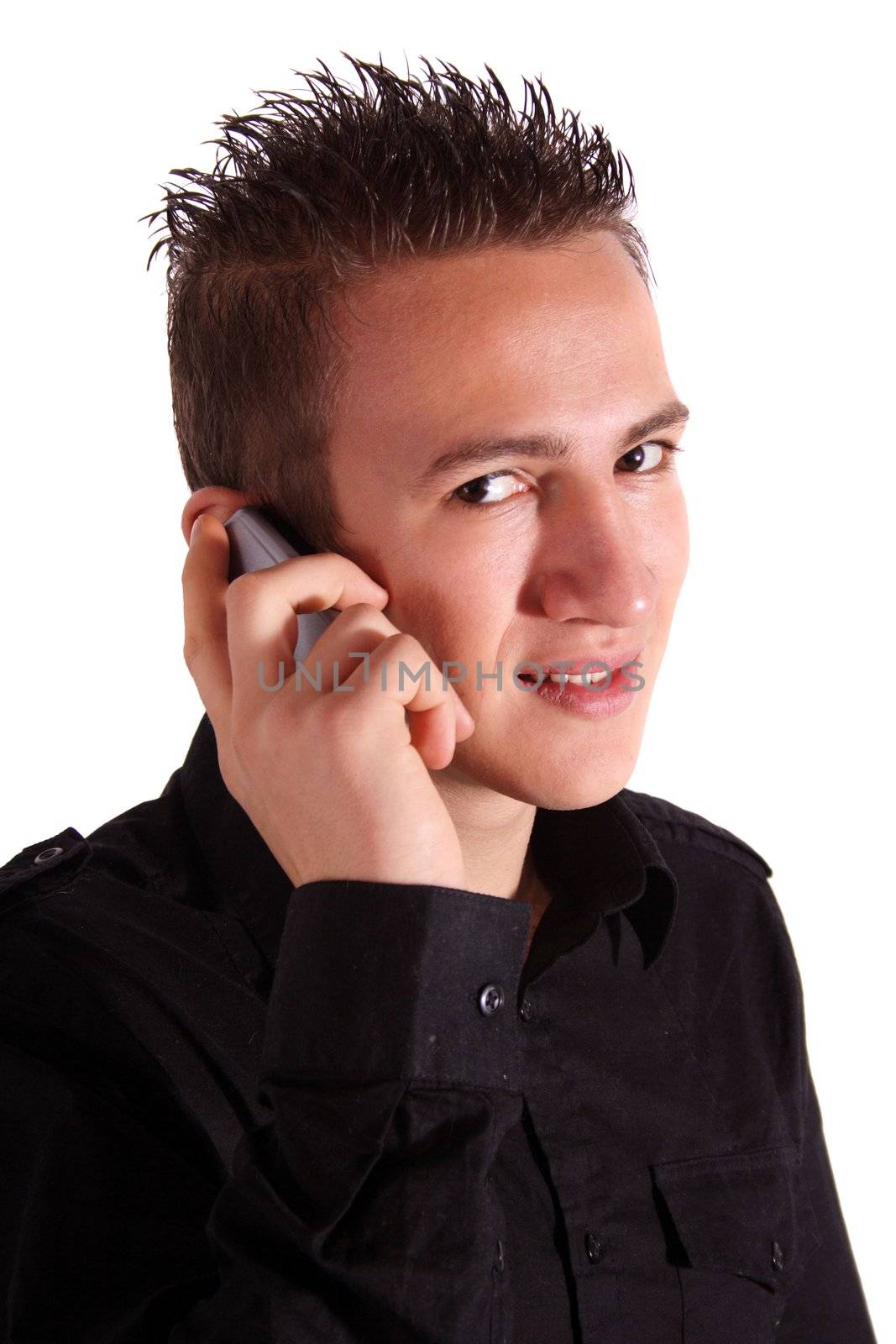 A young handsome man gives someone a call. All isolated on white background.