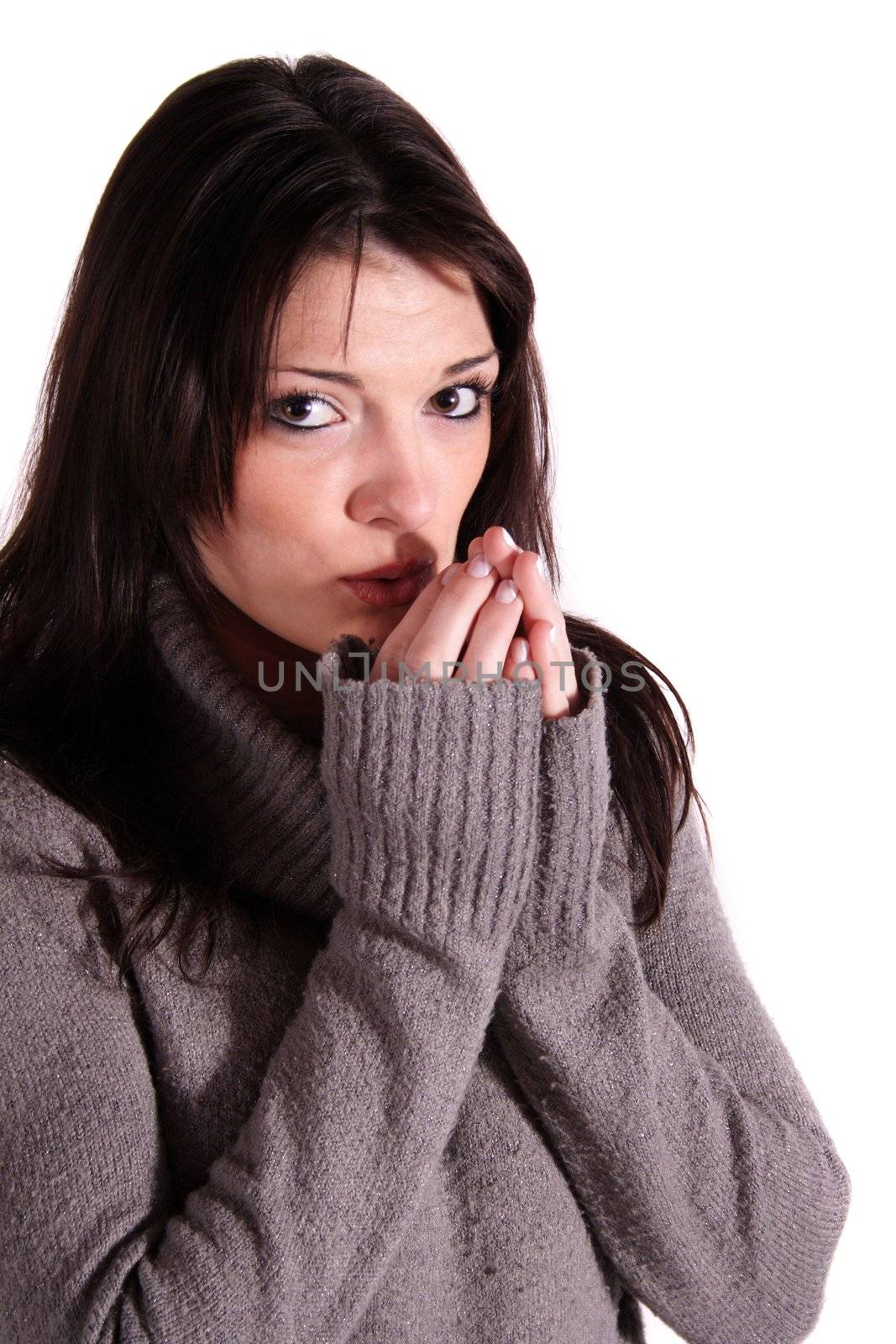 A handsome young woman freezing. All isolated on white background.