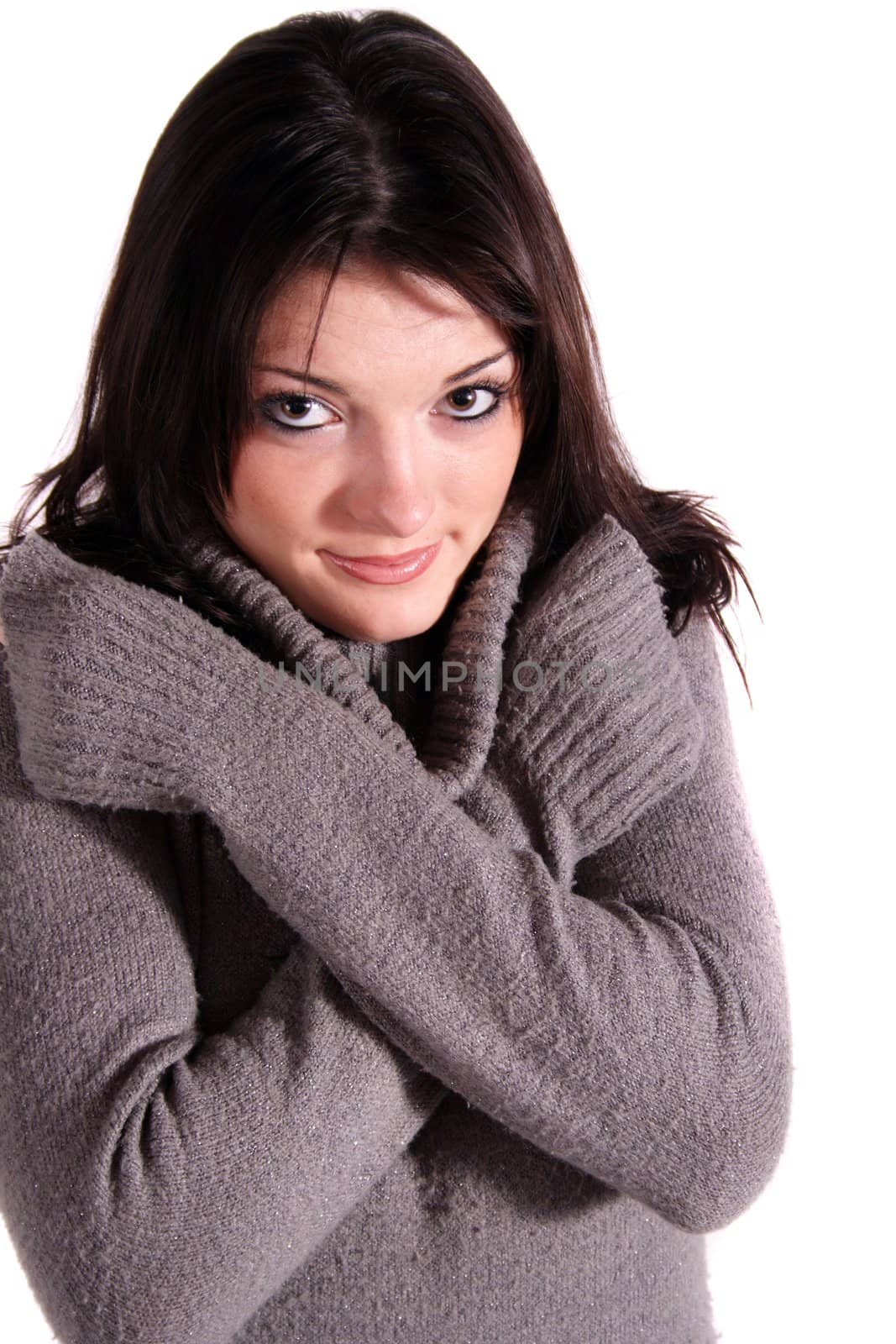 A handsome young woman freezing. All isolated on white background.