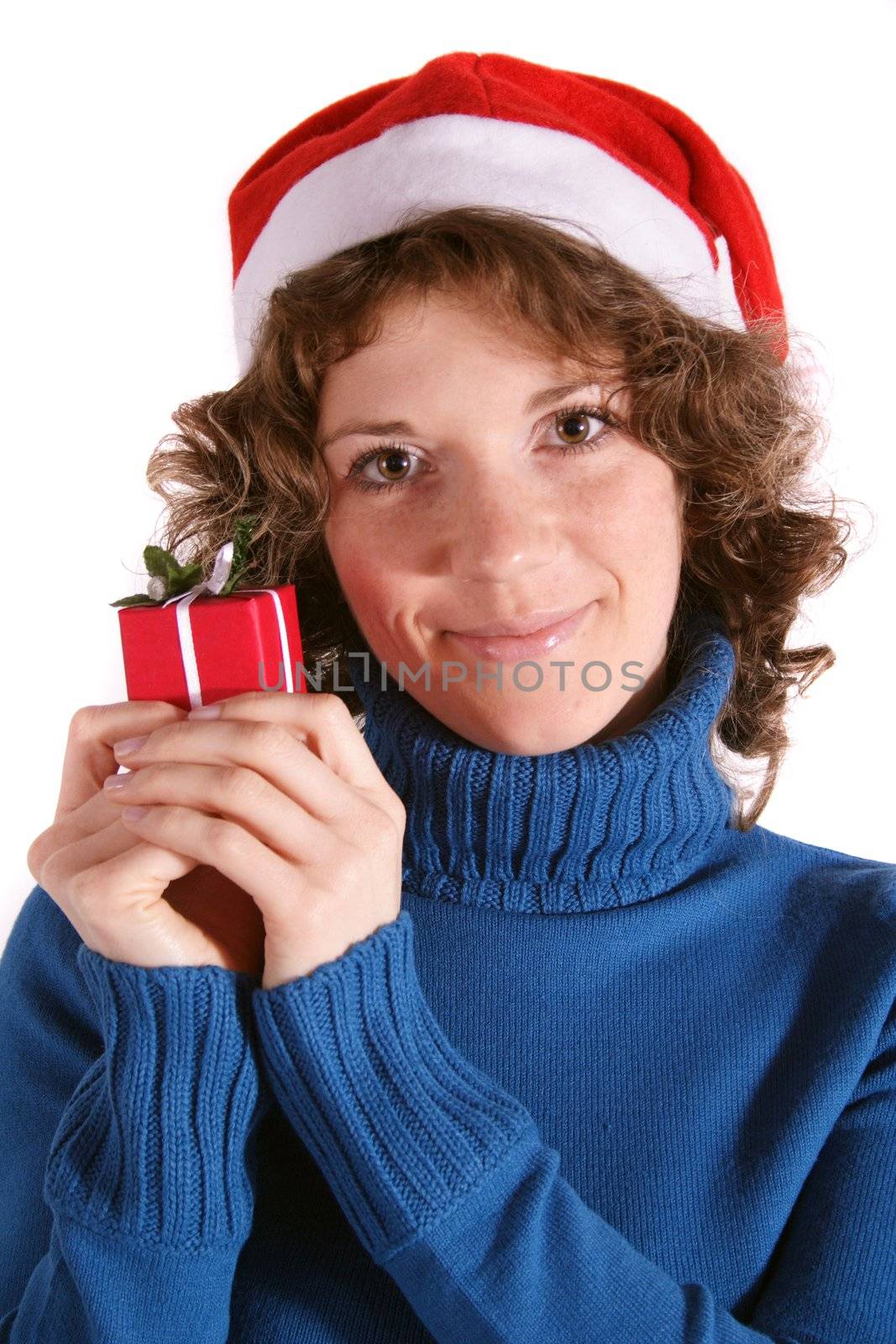 A handsomeyoung woman holding a small red present. All isolated on white background.