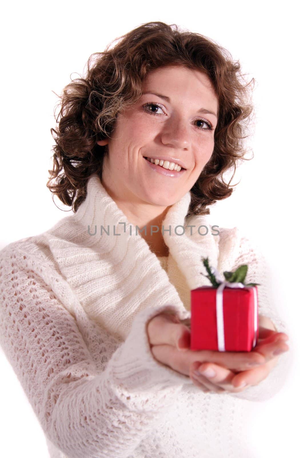 A handsome young woman holding a small red presents. All isolated on white background.