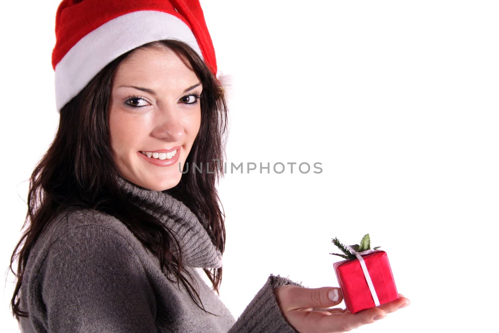 A handsome young woman holding a small red present. All isolated on white background.