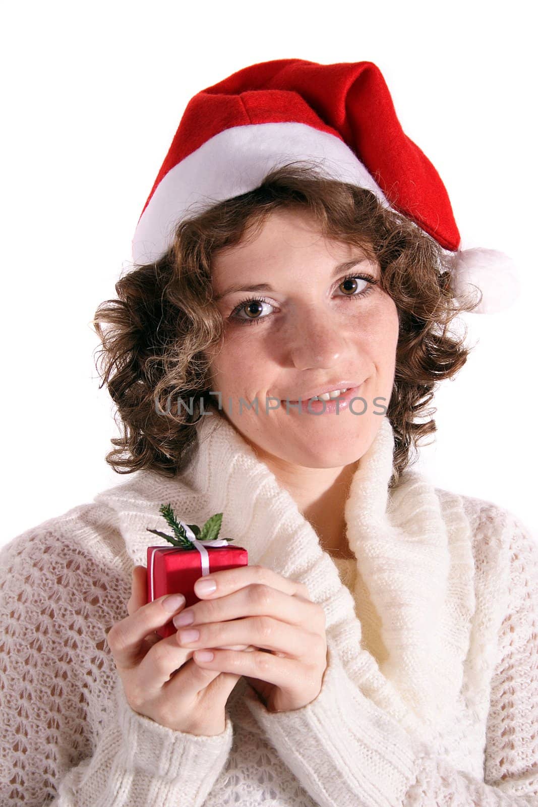 A handsome young woman holding a little Christmas present. All isolated on white background.