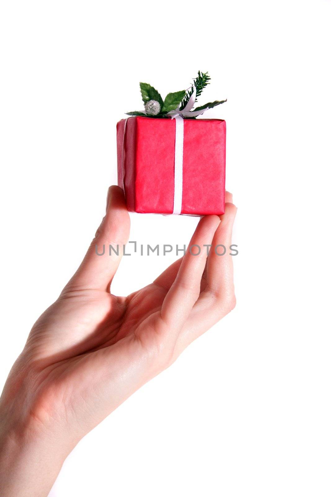 A hand with a little red present. All isolated on white background.