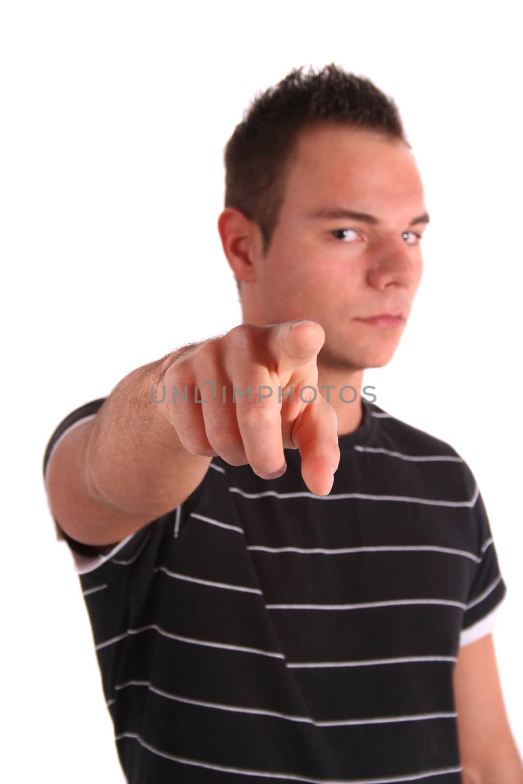 A handsome young man pointing at someone or something. All isolated on white background.