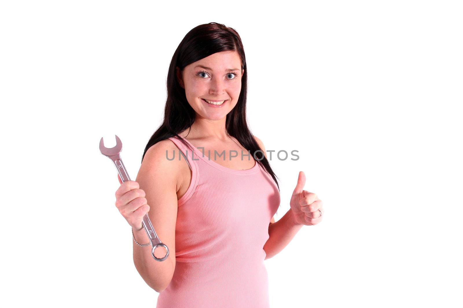 A handsome smiling woman holding a screw-wrench. All isolated on white background.