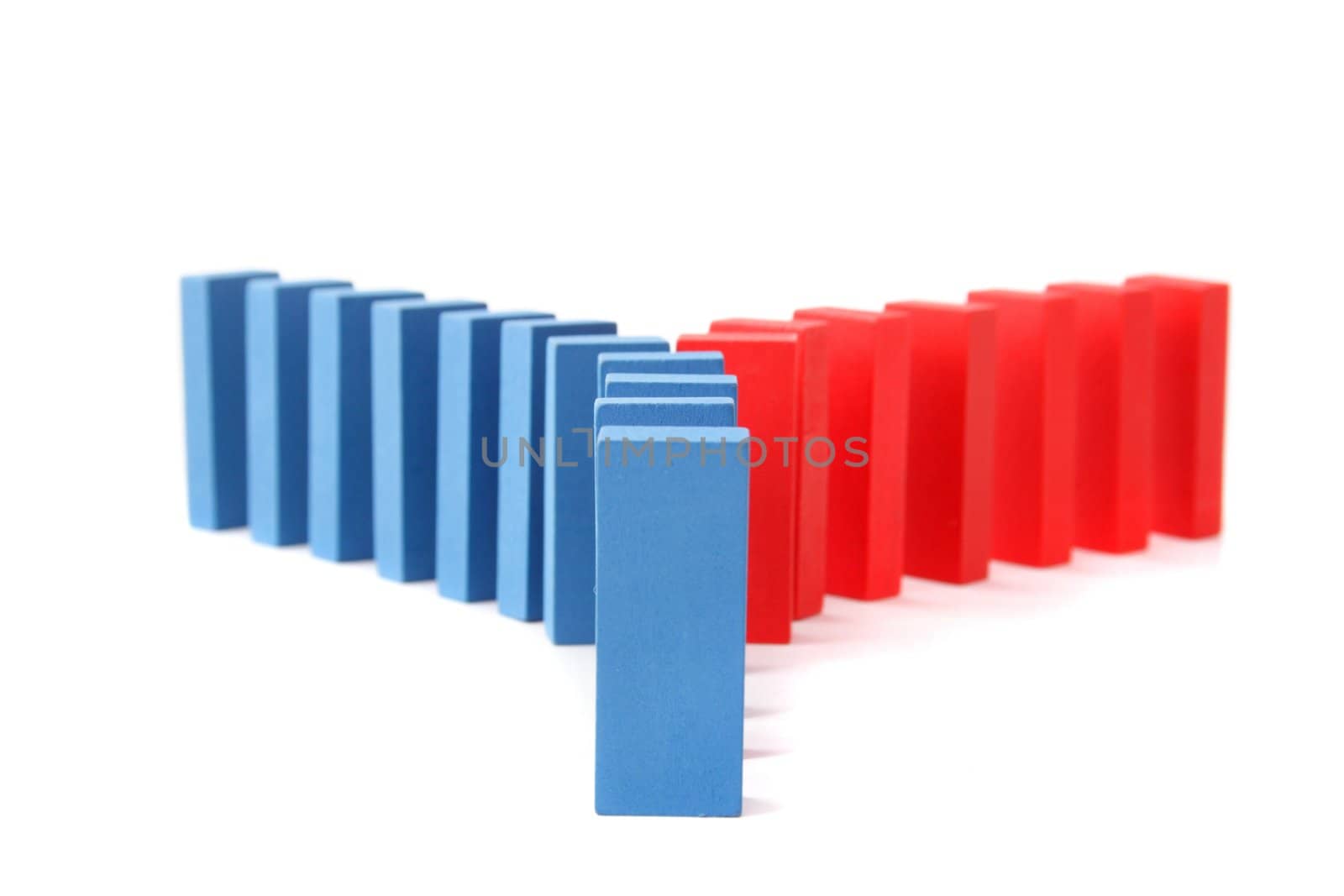 A line of blue dominoes with a turning of red ones. All ioslated on white background.