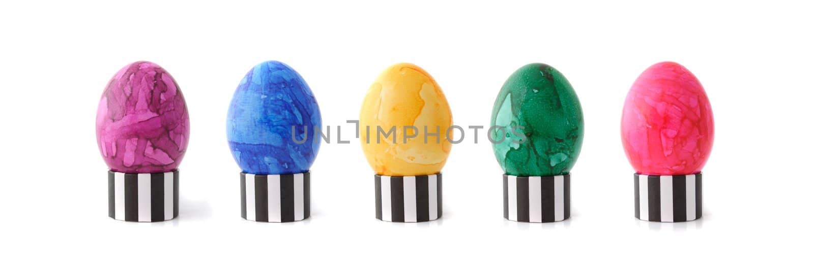 A line of colored easter eggs. All isolated on white background.