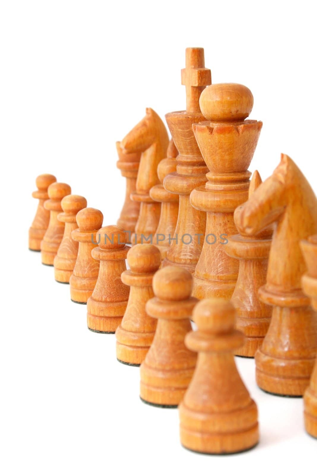 Chessmen standing side by side. All isolated on white background.